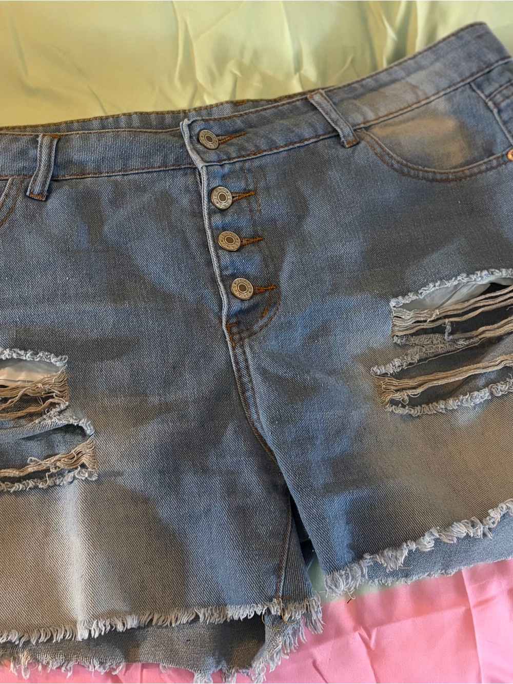 High-Rise Distressed Denim Shorts in Faded Blue